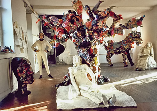 Niki de Saint Phalle in her studio at Soisy, surrounded by Le Mangeur  d'Enfants, La Mariée sous l'Arbre, and Le Cheval et la Mariée..jpg