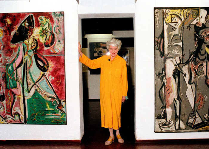 Guggenheim poses with Jackson Pollock paintings at the palazzo, 1979.jpg